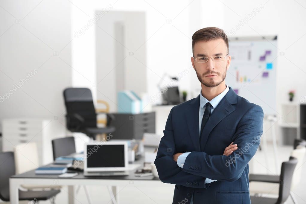 Young handsome man in office