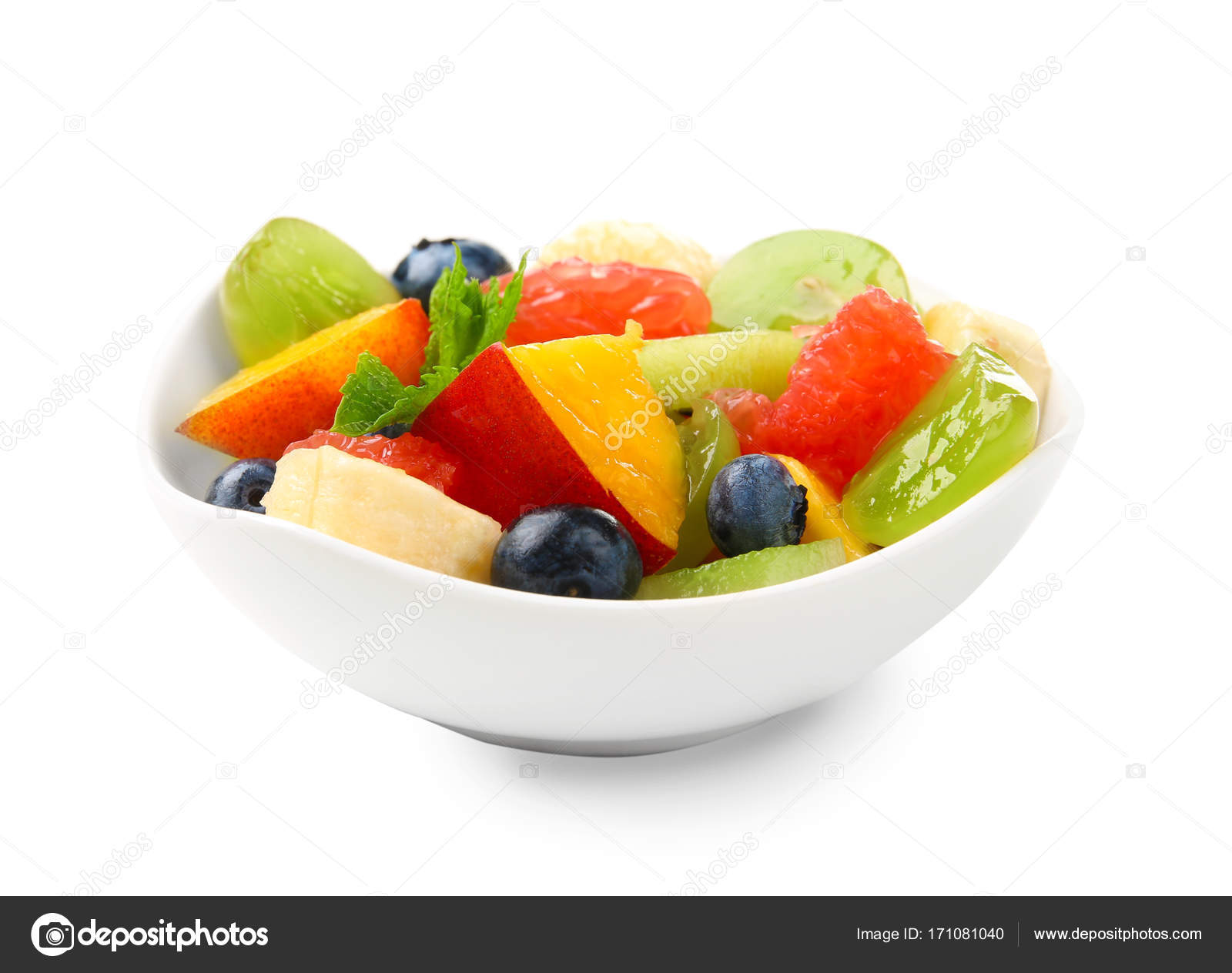 Bowl With Delicious Fruit Salad On White Background Stock Photo