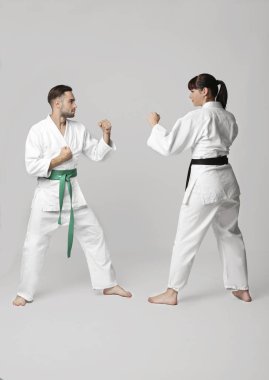 man and woman practicing karate   clipart