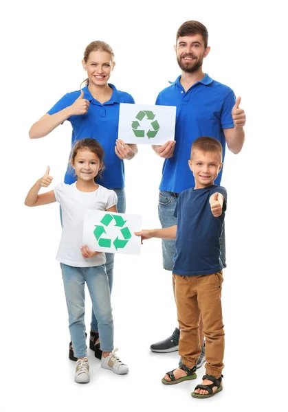 Family holding paper sheets with recycling symbol on white background — Stock Photo, Image