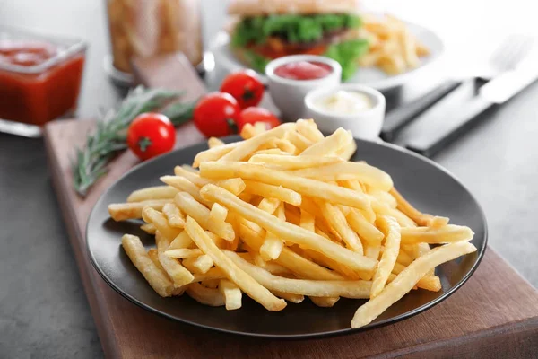 Plate with yummy french fries — Stock Photo, Image