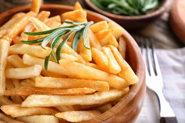 Bowl with yummy french fries on table, closeup — Stock Photo, Image