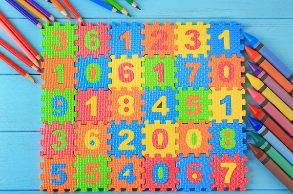 Math puzzle, pencils and crayons — Stock Photo, Image