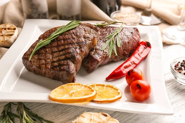 Plate with delicious grilled steaks — Stock Photo, Image