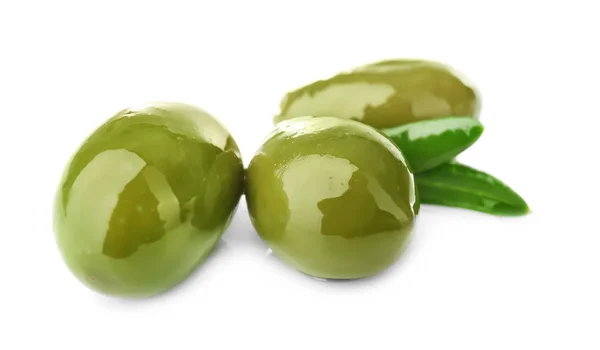 Green canned olives on white background — Stock Photo, Image