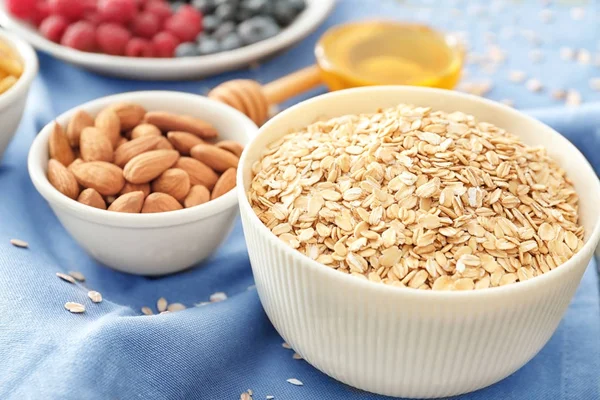 Bowls with oatmeal flakes — Stock Photo, Image