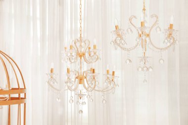 Miniature chandeliers in wedding hall clipart