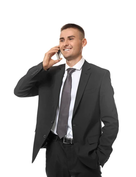 Knappe jonge zakenman praten op mobiele telefoon tegen witte achtergrond — Stockfoto