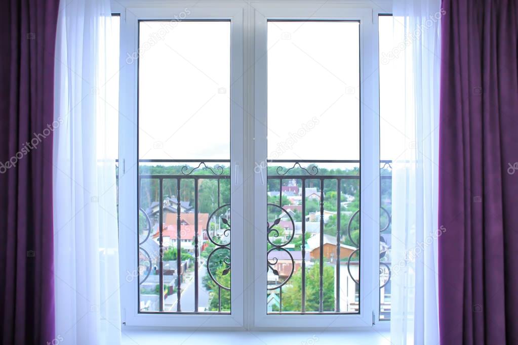 Window with beautiful white curtains