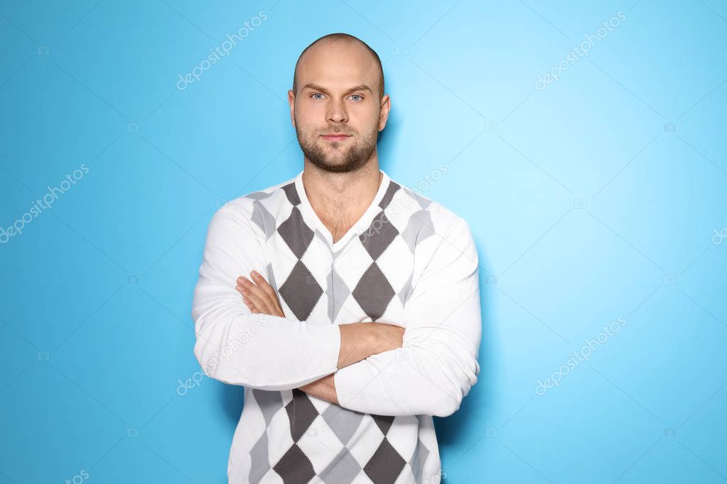 Young man on color background