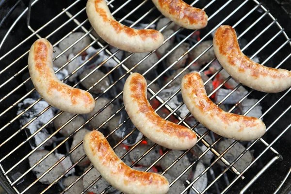 Sausages on barbecue grill — Stock Photo, Image