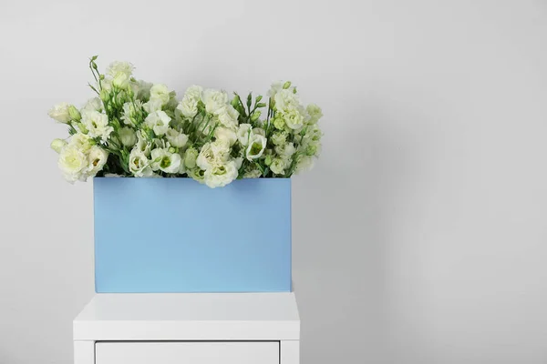 Beautiful flowers in paper box