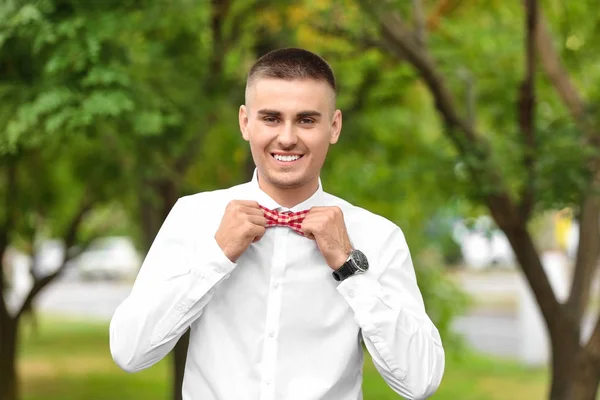 Handsome young man in park — Stock Photo, Image