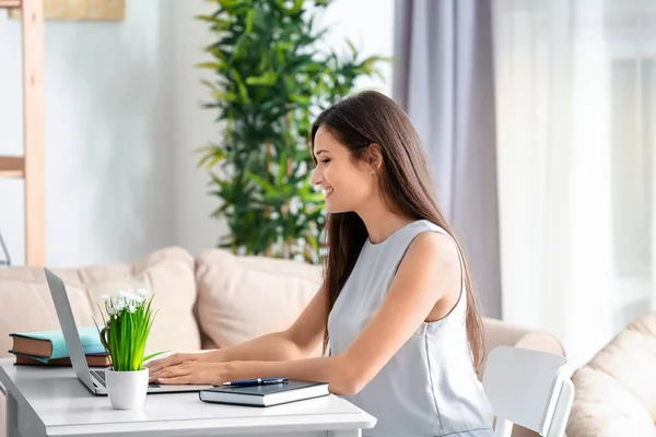 Pretty woman with modern laptop — Stock Photo, Image