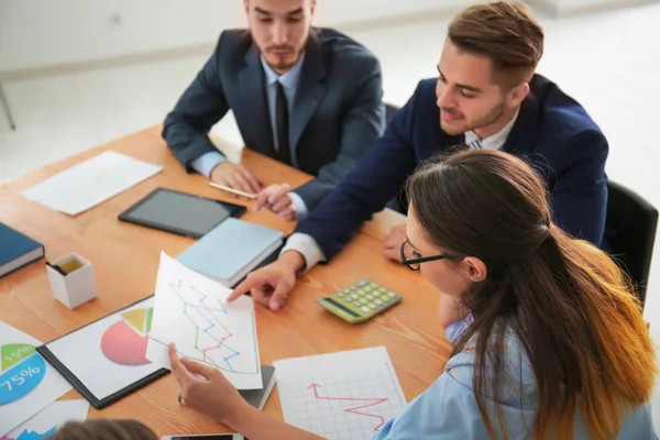 Team of young managers discussing project in office — Stock Photo, Image