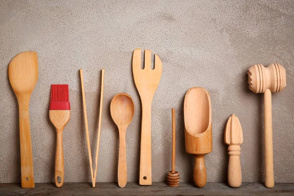 Wooden kitchen utensils on table — Stock Photo, Image