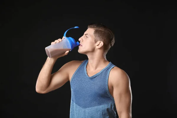 Young man drinking protein shake — Stock Photo, Image