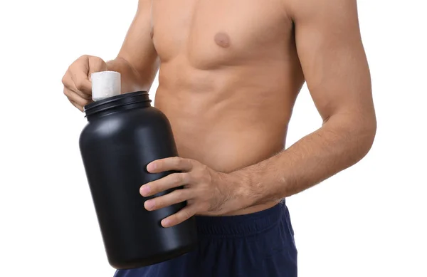 Shirtless young man holding protein powder — Stock Photo, Image