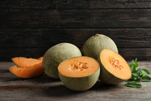 Fresh ripe melons on wooden background — Stock Photo, Image