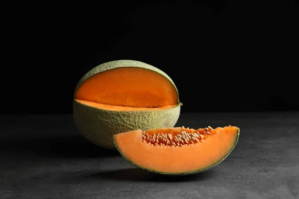 Fresh ripe melon on dark background — Stock Photo, Image