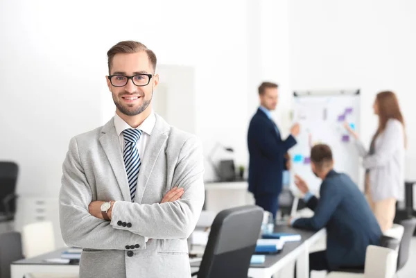 Young handsome man in office — Stock Photo, Image