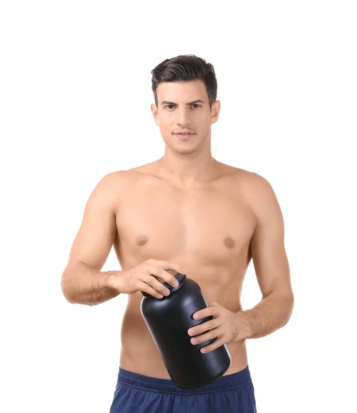 裸男青年手持蛋白粉黑罐 — 图库照片