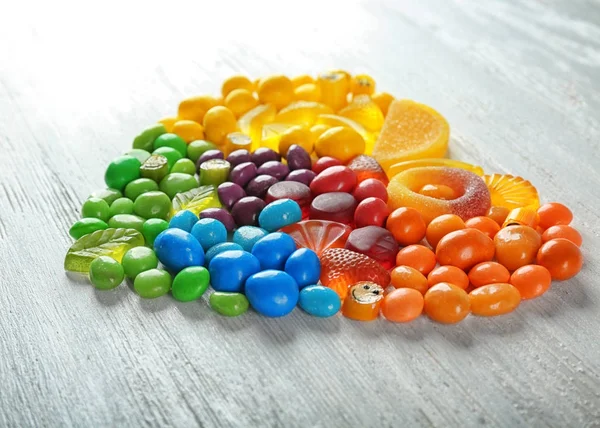 Colorful candies arranged as heart — Stock Photo, Image