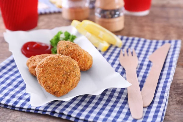Paper plate with delicious salmon patties