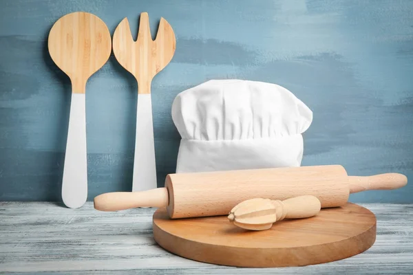 Kitchen utensils and chef hat — Stock Photo, Image