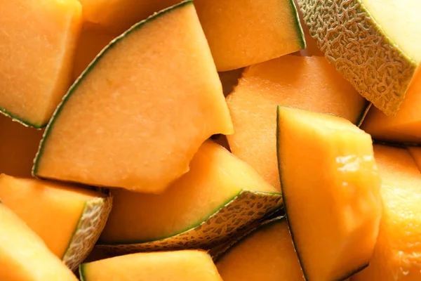 Gesneden van rijpe meloen als achtergrond — Stockfoto