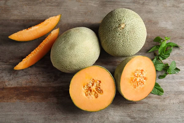 Fresh ripe melons on wooden background — Stock Photo, Image