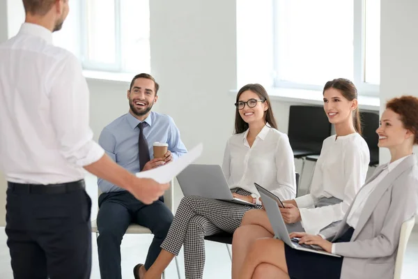 Team of young professionals conducting business meeting in office — Stock Photo, Image