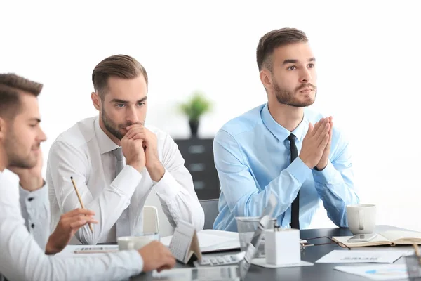 Team of young managers discussing project in office — Stock Photo, Image