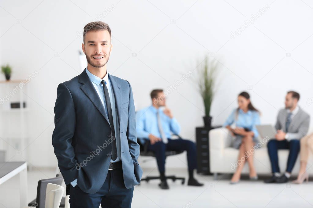 Young handsome man in office
