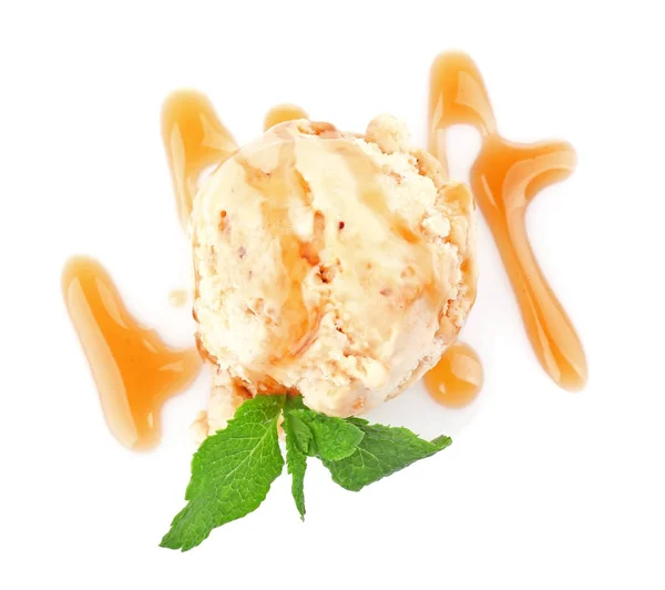 Scoop of ice cream with caramel topping and mint — Stock Photo, Image