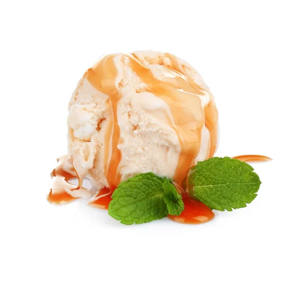 Scoop of ice cream with caramel topping and mint — Stock Photo, Image