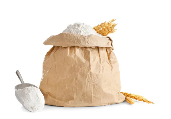 Paper bag and scoop with flour — Stock Photo, Image