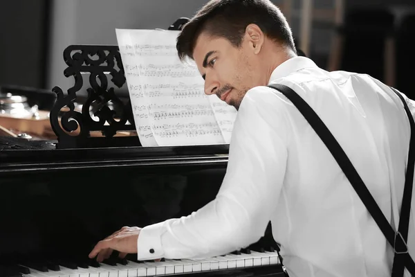 Young man playing piano