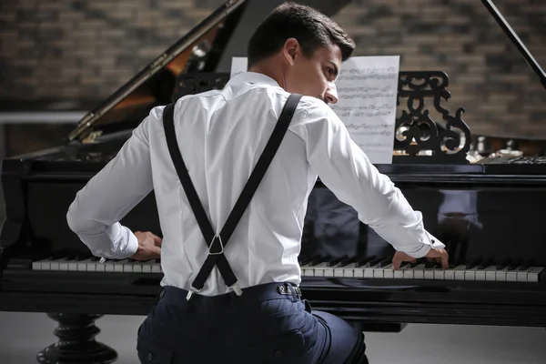 Young man playing piano