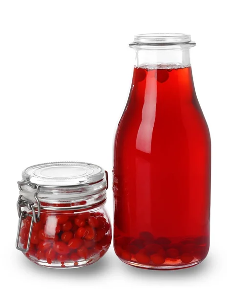 Бутылка сока годзи и банка с ягодами — стоковое фото