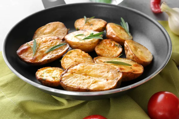 Delicious baked potatoes with rosemary — Stock Photo, Image