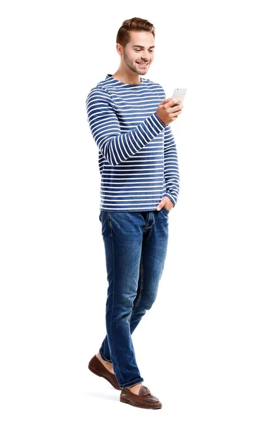 Young handsome man using his mobile phone — Stock Photo, Image