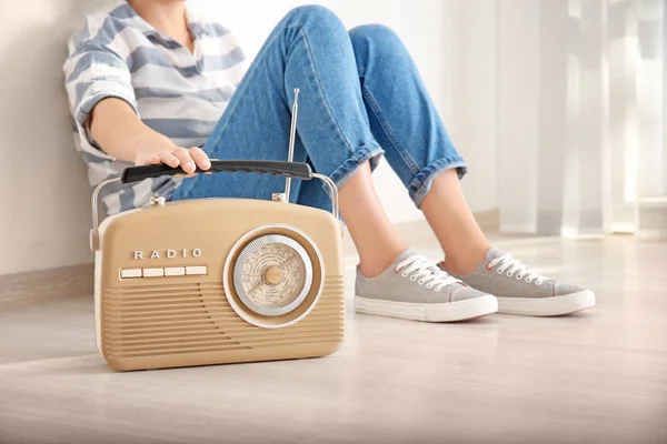 Woman with retro radio