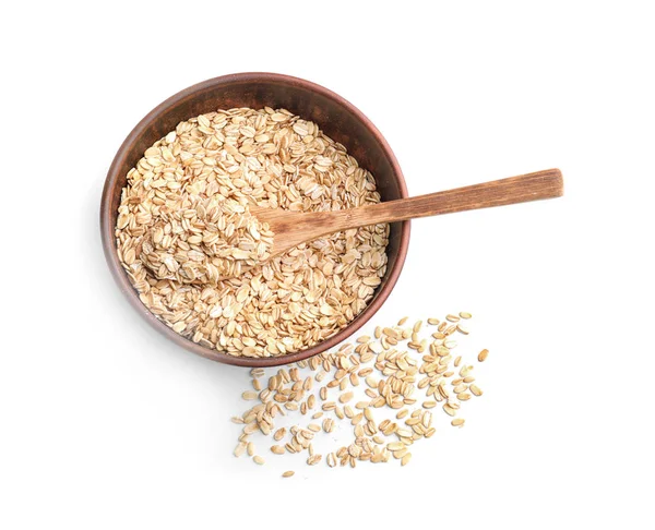 Bowl with raw oatmeal and spoon — Stock Photo, Image