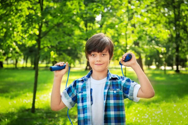 Cute little boy with jumping rope — Stock Photo, Image