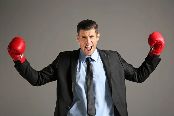 Businessman in boxing gloves — Stock Photo, Image