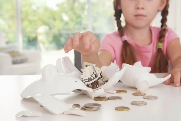 Cute Little Girl Broken Piggy Bank Indoors — Stock Photo, Image