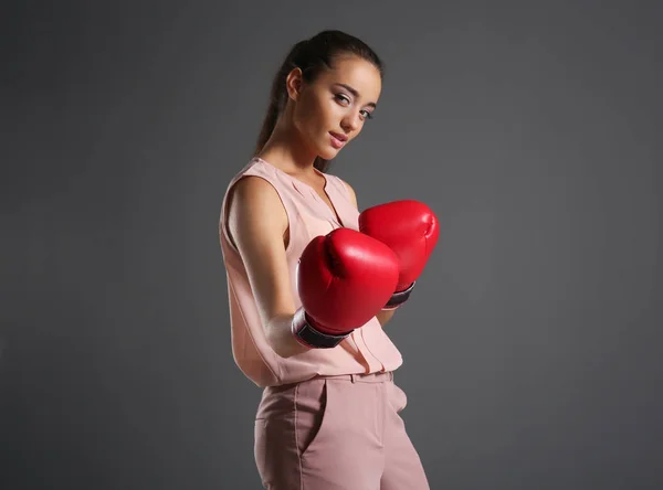 Young woman in boxing gloves