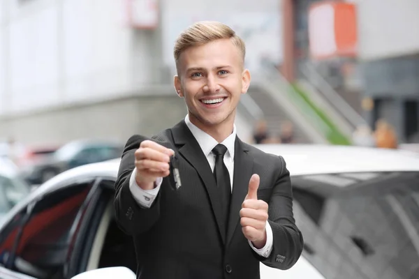 Young car salesman Royalty Free Stock Images