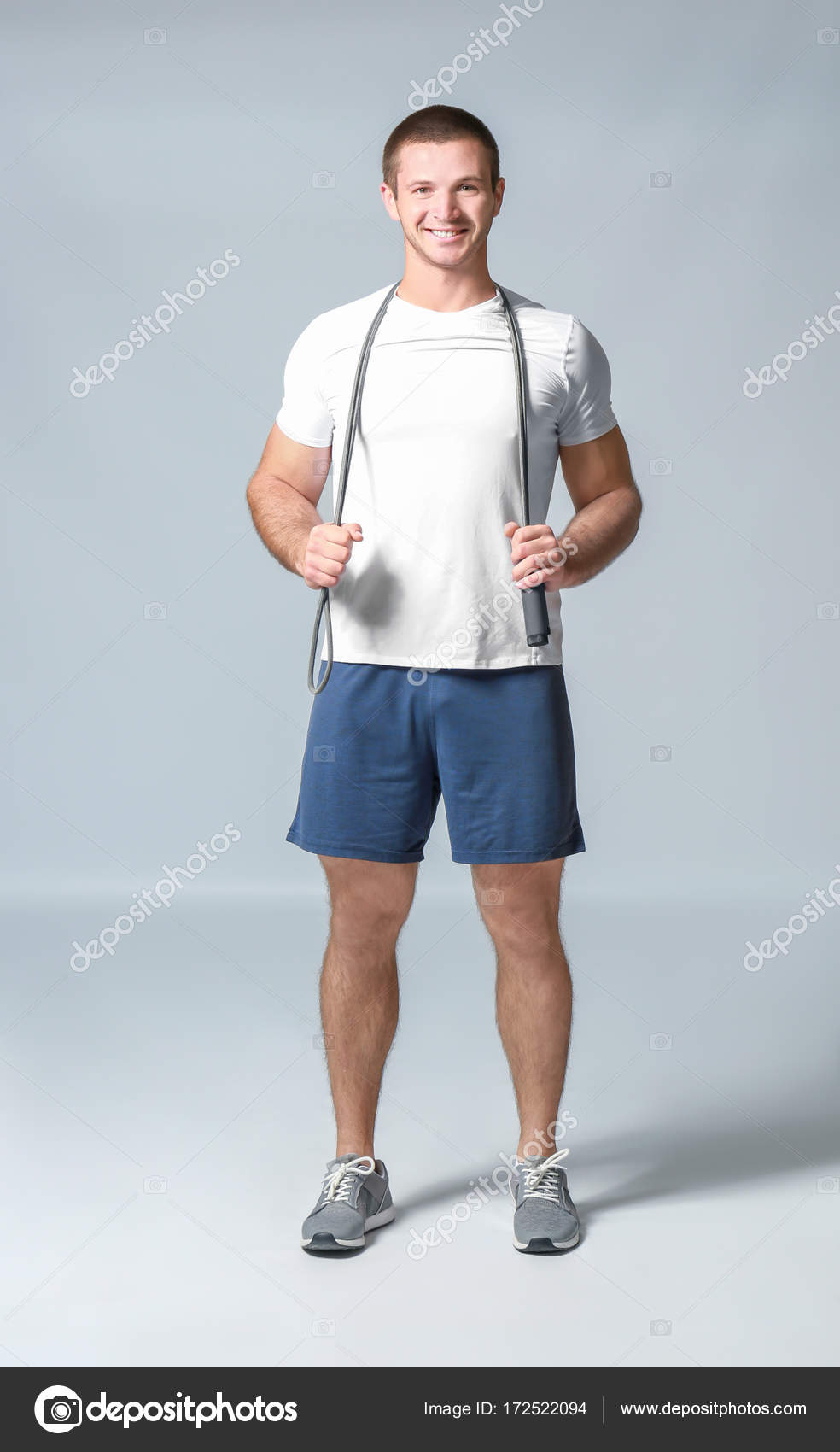 Young man with jumping rope — Stock Photo © belchonock #172522094